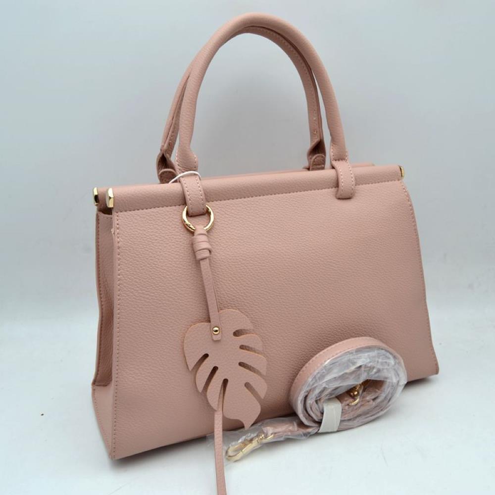 Pink This stylish structured handbag is designed for everyday elegance and practicality. Crafted with a premium textured finish, it features a sleek top-handle design with gold-tone hardware accents for a luxurious touch. The spacious interior provides enough room for daily essentials like phone, wallet, cosmetics, and small accessories, making it perfect for both office and casual use. It also comes with a detachable and adjustable shoulder strap for versatile carrying options.
