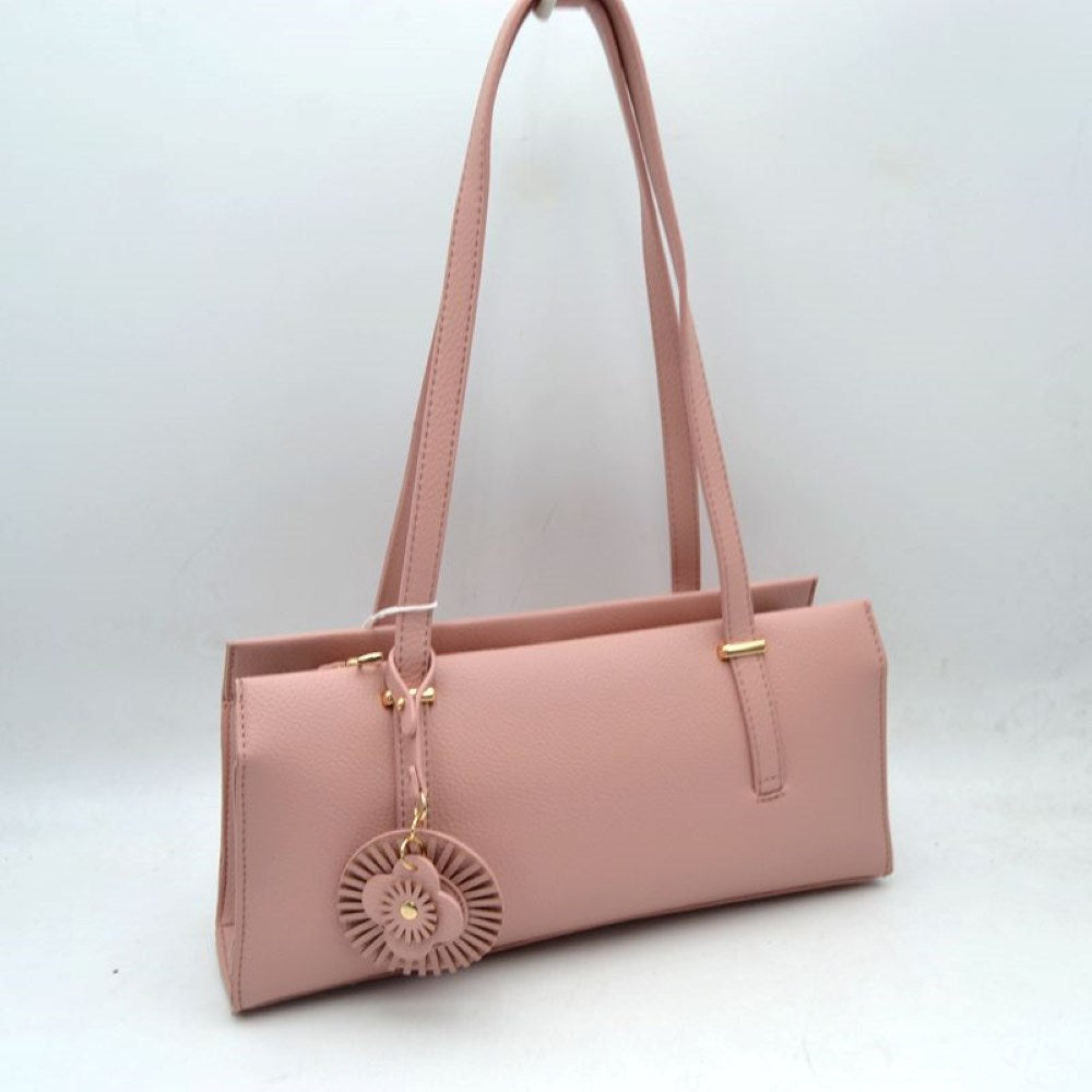 Pink Upgrade your everyday style with this sleek and sophisticated black shoulder tote bag. Designed with a modern rectangular silhouette, this handbag combines elegance and practicality for daily use. Crafted from textured faux leather, it features comfortable shoulder straps, a spacious interior, and a stylish decorative charm for a fashionable finishing touch. Perfect for work, shopping, casual outings, or evening occasions, this versatile bag complements both formal and casual wardrobes.