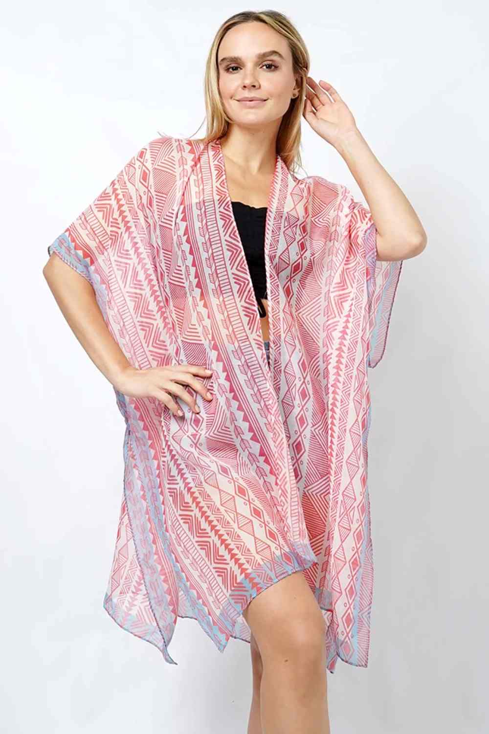 Pink Embrace effortless elegance with this Ethnic Pattern Print Kimono. Featuring a striking ethnic-inspired design, this lightweight piece drapes beautifully over any outfit for an instant style upgrade. Crafted from 100% polyester for easy care and durability, it offers comfortable wear throughout the day. With a generous 35" length, it provides excellent coverage and movement.