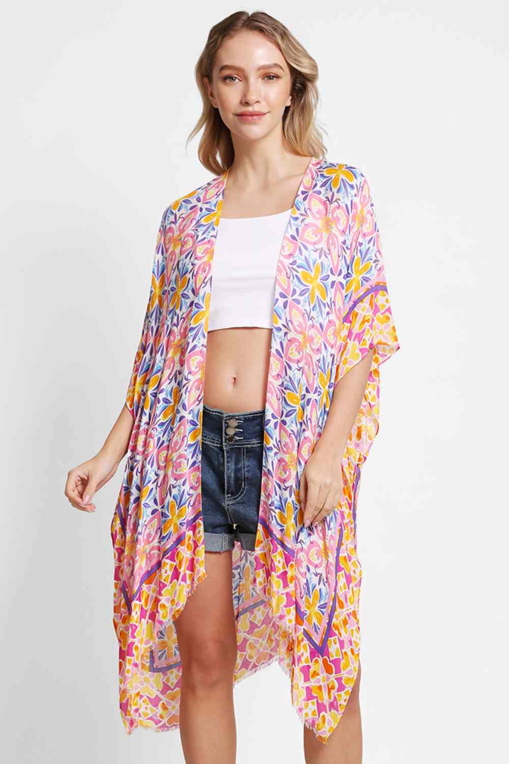 Pink Effortless elegance meets summer style with this floral abstract pattern kimono cover up. Crafted from 100% viscose, the lightweight fabric drapes beautifully while keeping you cool and comfortable. Perfect for beach days, poolside lounging, or casual outings, this versatile piece layers seamlessly over swimwear or light clothing. The generous 38" x 39" dimensions provide relaxed, flowing coverage. A timeless addition to any warm-weather wardrobe.