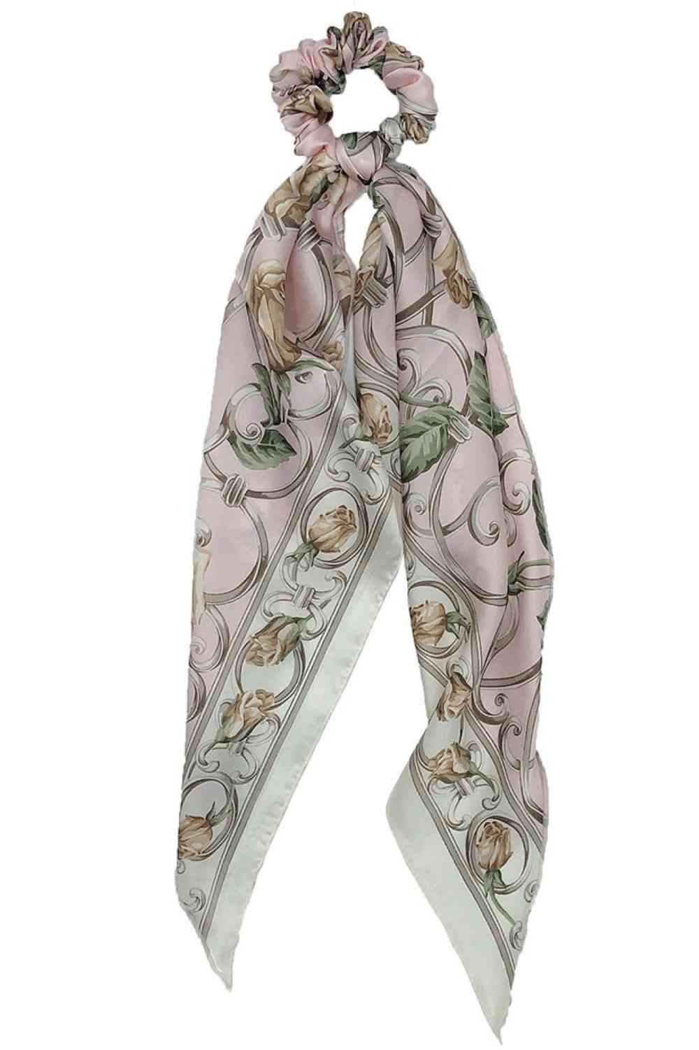Pink Elevate your hair accessory game with this charming floral print scarf ponytail holder. Crafted from 100% polyester, it combines style with practicality, keeping your hair secured while adding a pop of color to your look. The versatile one-size design works for all hair types and occasions from casual days to special events. Perfect for anyone who loves effortless elegance and floral aesthetics.
