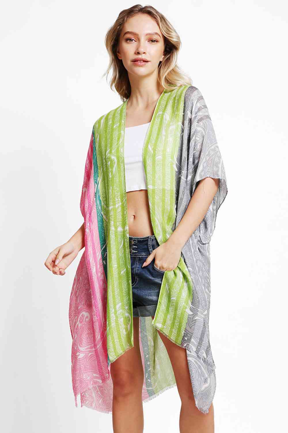 Pink Gray Effortless elegance meets summer style with this Paisley Pattern Stripe Kimono Cover Up. Crafted from 100% viscose, the lightweight fabric drapes beautifully while keeping you cool and comfortable. The intricate paisley and stripe design adds visual interest to any beach or resort look. Perfect for layering over swimwear or wearing as a standalone piece. Dimensions: 38" x 39". Made in China.