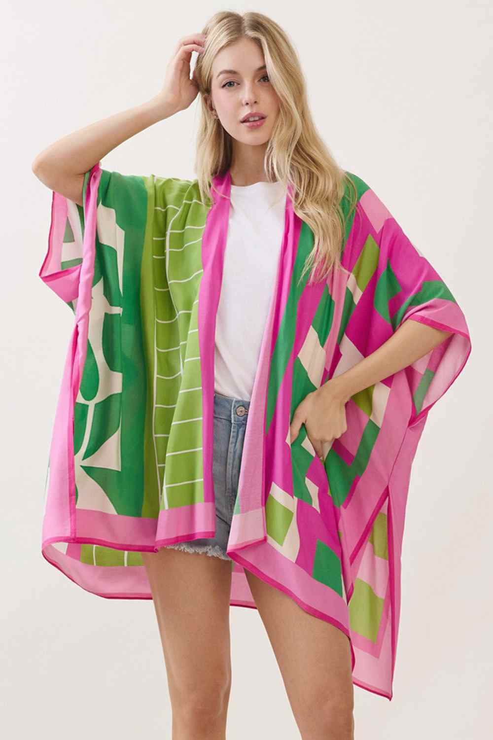 Pink Green Effortless elegance meets versatile style with this geometric pattern mixed print kimono cover up. Crafted from 100% viscose, the lightweight fabric drapes beautifully over swimwear, dresses, or casual outfits, making it perfect for beach days, resort wear, or layering year-round. The eye-catching geometric and mixed print design adds visual interest to any ensemble. Measuring 40" x 60", it offers generous coverage and comfortable movement. An essential piece for anyone seeking laid-back sophisti