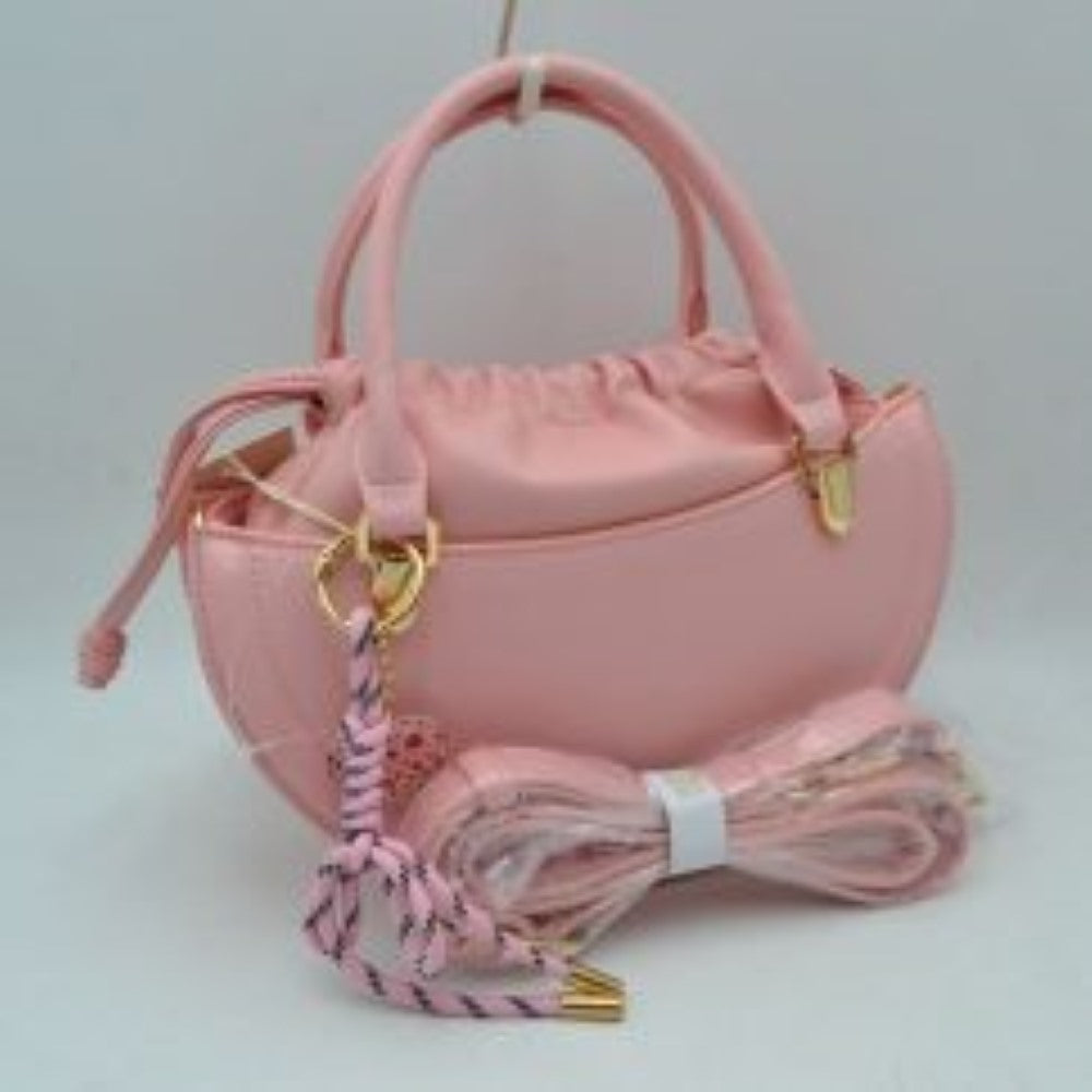Pink This everyday handbag showcases a structured crescent silhouette with a distinctive curved profile. Designed for versatility, it features dual rounded top handles alongside a detachable and adjustable long shoulder strap secured by metallic hardware. The interior storage includes a gathered inner pouch with a functional drawstring closure, while the outer shell forms an additional open compartment for quick-access items.