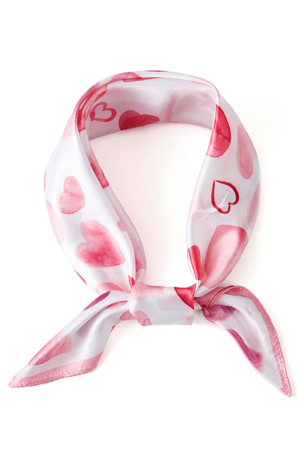 Pink Elevate your accessory game with this charming Heart Pattern Print Bandana Scarf. Crafted from 100% lightweight polyester, this versatile square scarf measures 27.5" x 27.5", making it perfect for styling around your neck, head, or bag. The silky fabric drapes beautifully and feels soft against your skin, while the romantic heart print adds a touch of elegance to any outfit. Ideal for all seasons, this scarf transitions seamlessly from spring florals to cozy winter layers. Whether you're dressing up a 