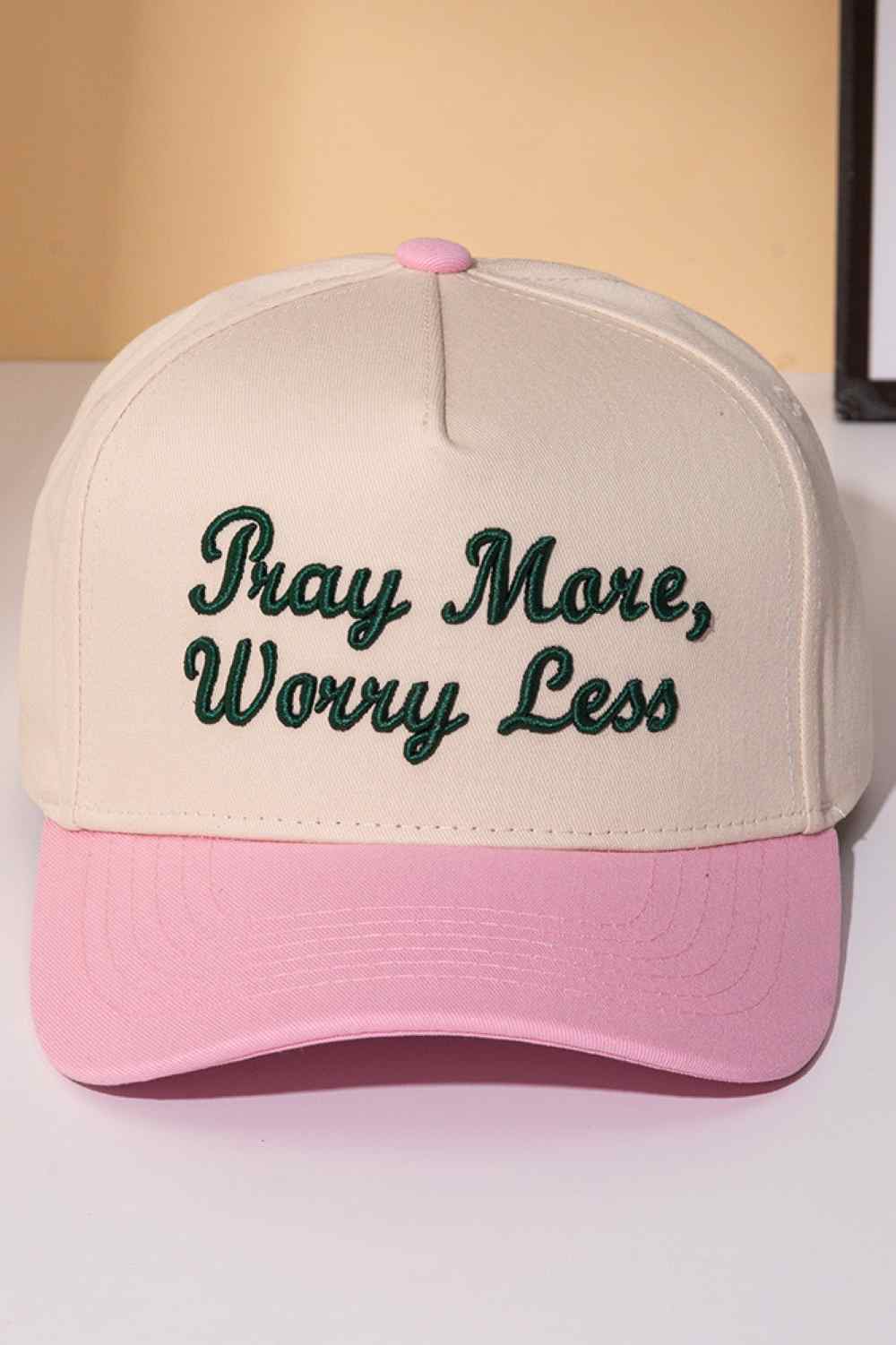 Pink Stay grounded with this classic two-tone trucker cap featuring an embroidered "PRAY MORE, WORRY LESS" message. Crafted from 100% cotton for breathability and comfort, it's designed to keep you cool whether you're on the road or relaxing at home. The adjustable snapback ensures a perfect fit for everyone, while the structured six-panel design offers timeless style. A meaningful reminder to embrace peace and let go of stress, one wear at a time.