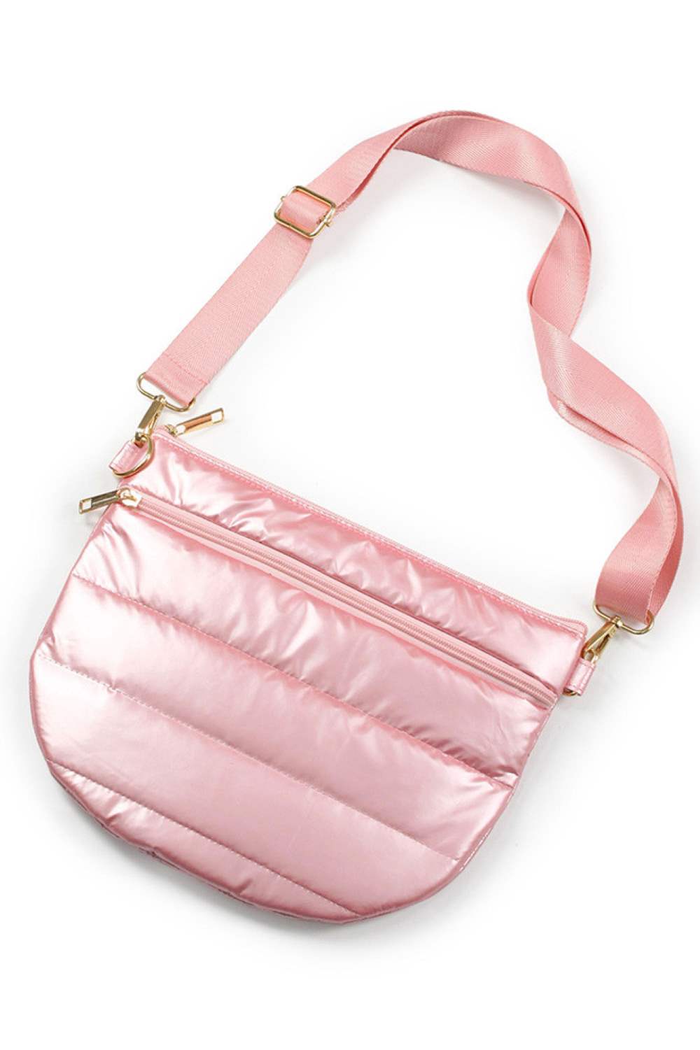 Pink The Puffy Half Moon Bag brings playful style to your everyday carry. Its distinctive half-moon silhouette offers a modern twist on classic bag design, while the soft, puffy construction adds dimension and visual interest. Crafted from durable 100% polyester, this bag is built to withstand daily use while maintaining its shape. The compact 11.5" x 8" size fits essentials perfectly ideal for quick outings, travel, or as a statement accessory.