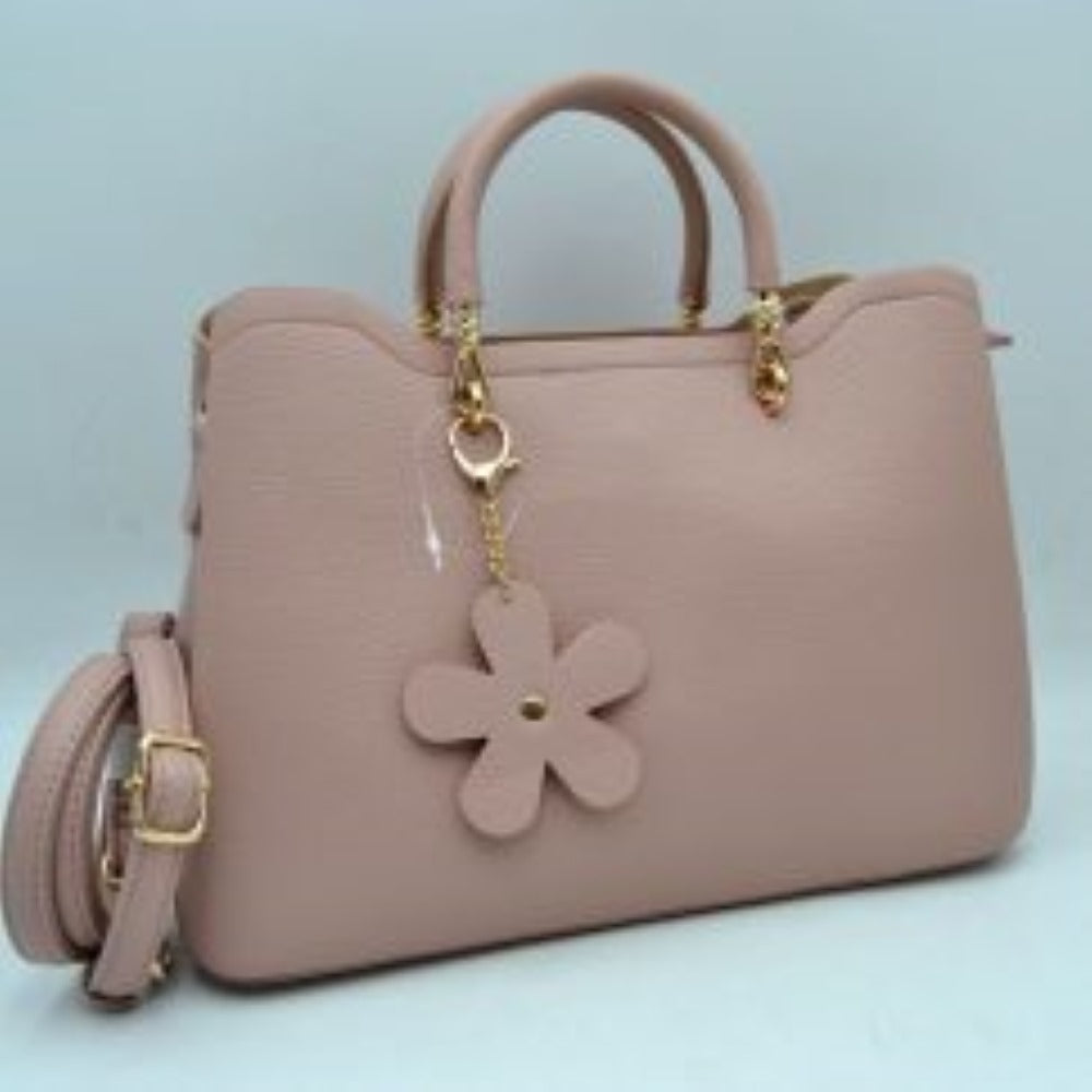 Pink Add a refined touch to your everyday accessories with this stylish satchel bag featuring structured top handles, a spacious interior, and a detachable shoulder strap for versatile carrying options. Designed to balance fashion and functionality, it offers ample room for daily essentials while maintaining a sleek and sophisticated silhouette. Decorative hardware accents and a charming floral pendant enhance its elegant appearance, making it suitable for work, shopping, travel, or casual outings.