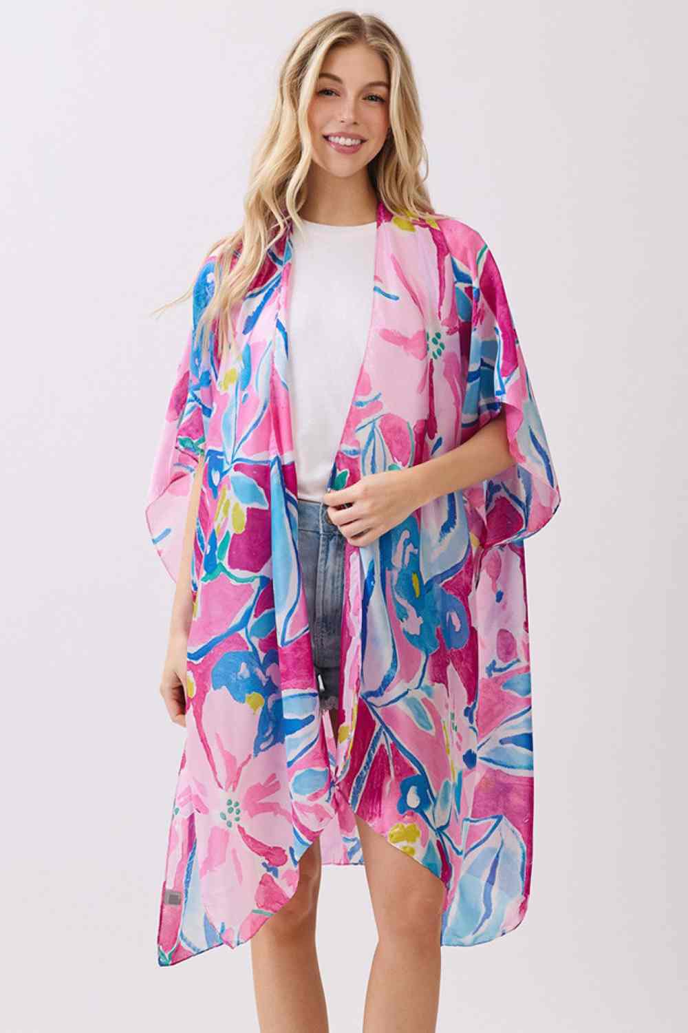 Pink Wrap yourself in effortless elegance with this vibrant botanic print kimono cover-up. Crafted from 100% polyester with a luxuriously silky feel, it drapes beautifully over swimwear, dresses, or casual outfits. The generous 35" x 36" dimensions provide comfortable coverage and movement. Perfect for beach days, resort wear, or layering during warmer months. A versatile piece that brings color and sophistication to any warm-weather wardrobe.
