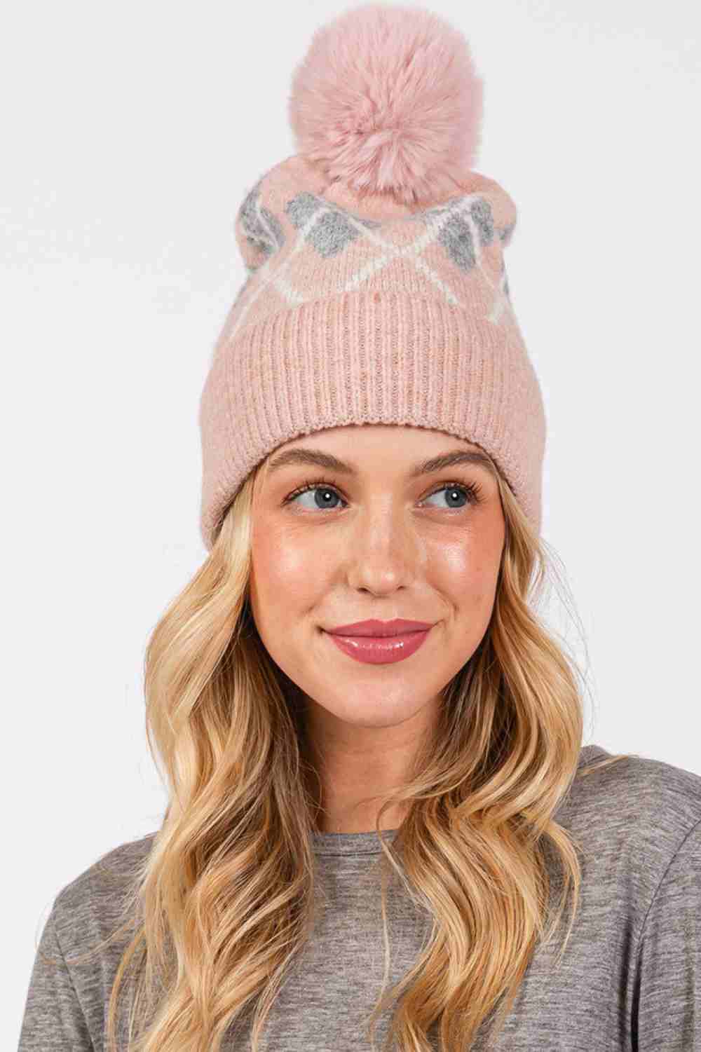 Pink Wool Blended Argyle Fleece Pom Pom Beanie features a classic argyle pattern with cozy fleece lining and a soft wool-blend knit for extra warmth and style. Finished with a fluffy pom and comfortable stretch fit, it keeps you snug while adding timeless charm to your winter outfits.