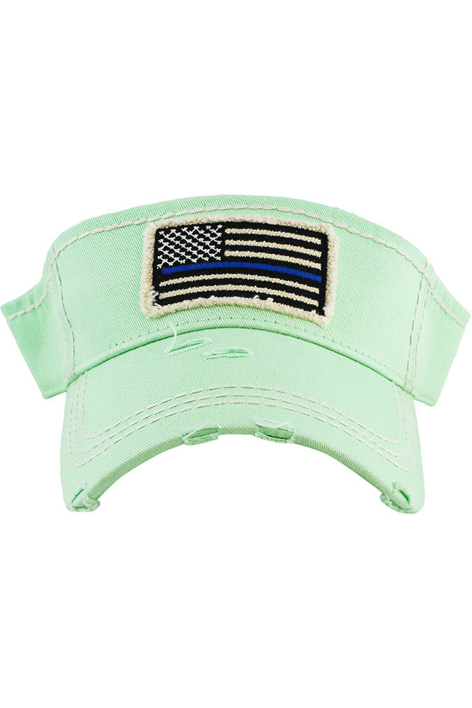 Pistachio The Blue Line Flag Vintage American Flag Sun Visor features a distressed patriotic design with the iconic blue line accent, showing support for law enforcement in a stylish, casual way. Its lightweight, adjustable fit and open-top design provide sun protection while keeping you cool and comfortable all day.