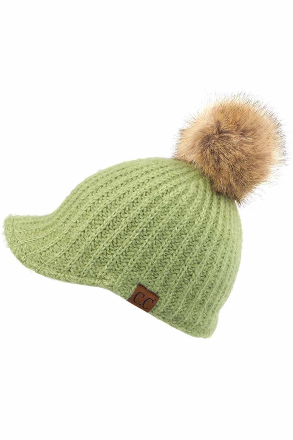 Pistachio Stay cozy with this knitted brim beanie featuring a plush pom pom detail. Crafted from a soft blend of 75% acrylic, 22% polyester, and 3% spandex, this winter essential delivers warmth and comfort in a versatile style. Available in nine rich colors including Beige, Berry, Dark Denim, Heather Gray, Ivory, Pistachio, Rose, Steel Blue, and Violet Purple. The ribbed knit construction and faux fur pom add texture and visual interest to any cold-weather outfit. Hand wash and lay flat to dry for lasting 
