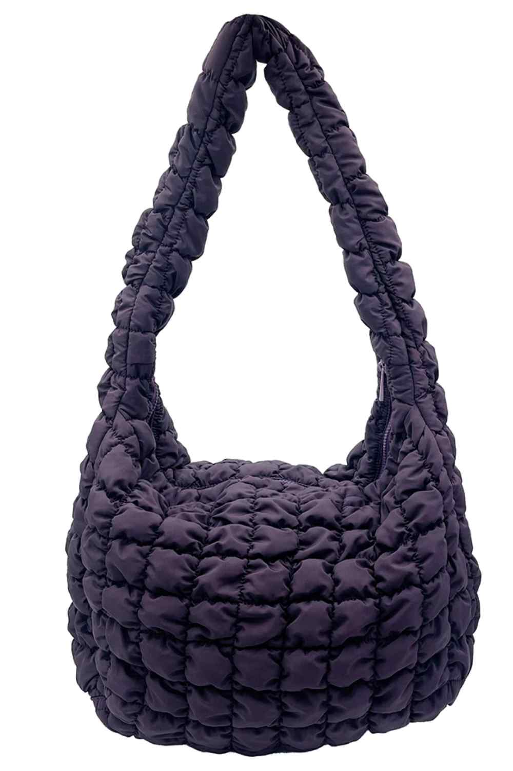 Plum Carry your essentials in style with this Large Quilted Solid Bag. Crafted from durable 100% polyester with a classic quilted design, it offers a sleek, versatile look that complements any outfit. The adjustable sling strap allows for comfortable crossbody wear, making it perfect for everyday errands, travel, or casual outings.