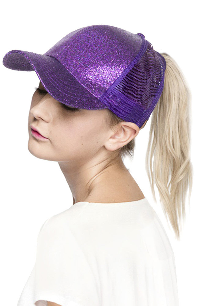 Purple C.C BASEBALL PONYCAP is a must-have accessory for any baseball fan. Made with high-quality materials, this cap offers both style and functionality. Featuring a ponytail holder, it allows for easy and comfortable wear while keeping your hair in place. Elevate your game day look with the C.C BASEBALL PONYCAP.