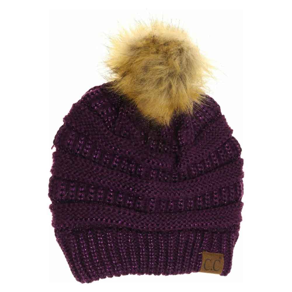Purple Metallic Fur Pom CC Beanie combines premium craftsmanship with modern aesthetics, featuring a metallic-threaded knit that adds subtle shimmer and a high-quality faux fur pom for a refined finish. Engineered to provide superior warmth and comfort, this beanie ensures a snug fit and durability, making it an essential accessory for cold-weather attire that balances functionality with sophisticated style. 