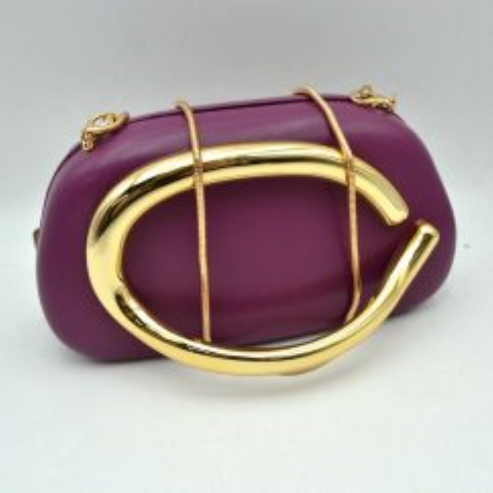Purple This structured, hard shell clutch bag functions as an elegant accessory for everyday use or special occasions, featuring a smooth matte surface. A large, prominent metallic ring handle anchors the front design, offering a secure hand-held grip. For alternative carrying styles, the bag is equipped with a detachable metallic snake chain strap that secures to the top corners with lobster claw clasps, providing functional storage in a compact, rigid silhouette.