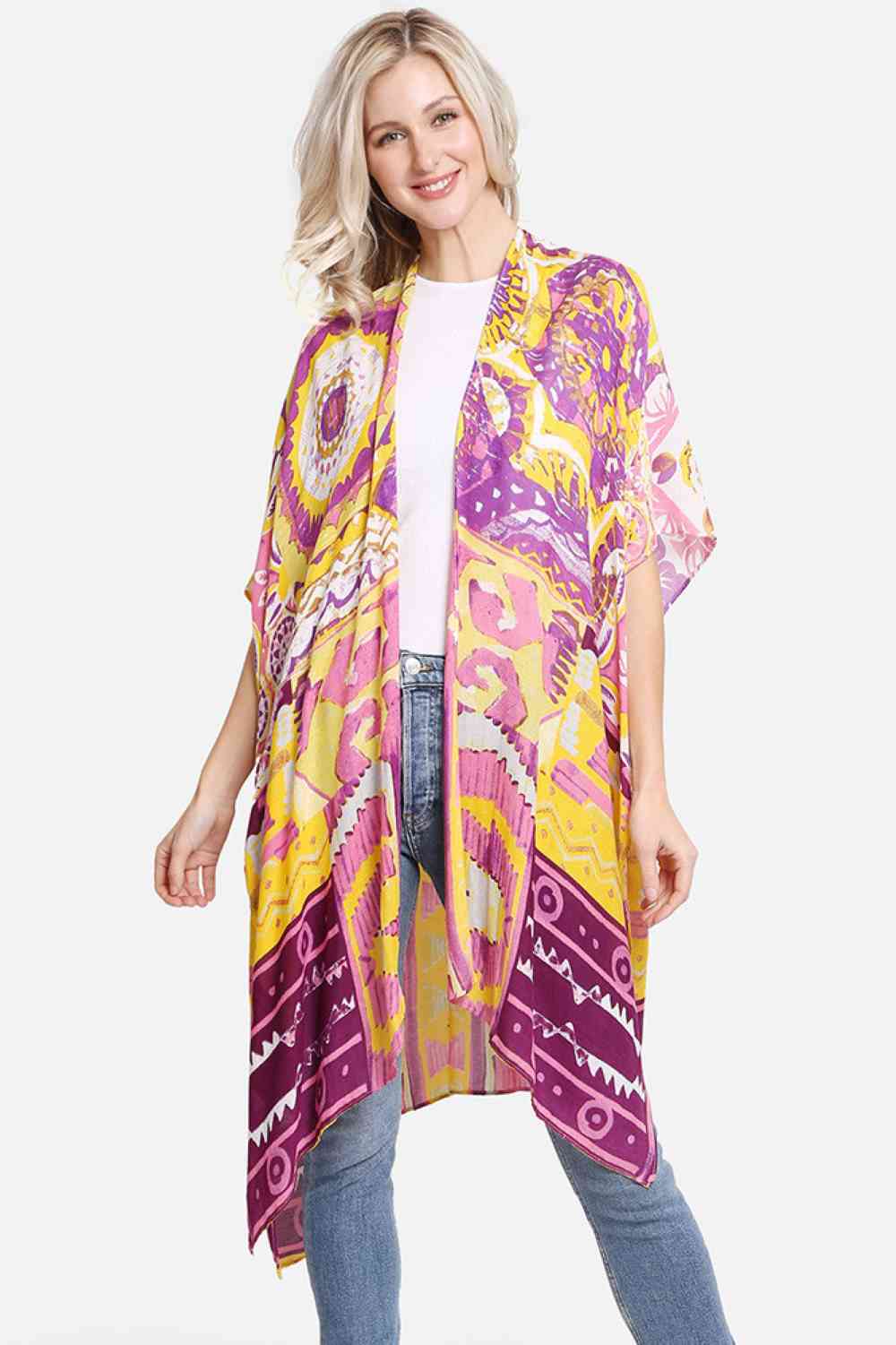 Purple Effortless elegance meets artistic flair with this abstract pattern print kimono. Crafted from 100% viscose, the fabric drapes beautifully while maintaining a soft, breathable feel perfect for layering or wearing solo. The generous 38" x 39" dimensions offer comfortable coverage and movement. Whether you're heading to the beach, brunch, or casual evening out, this versatile cover-up transitions seamlessly from day to night. A timeless piece that adds visual interest to any wardrobe.