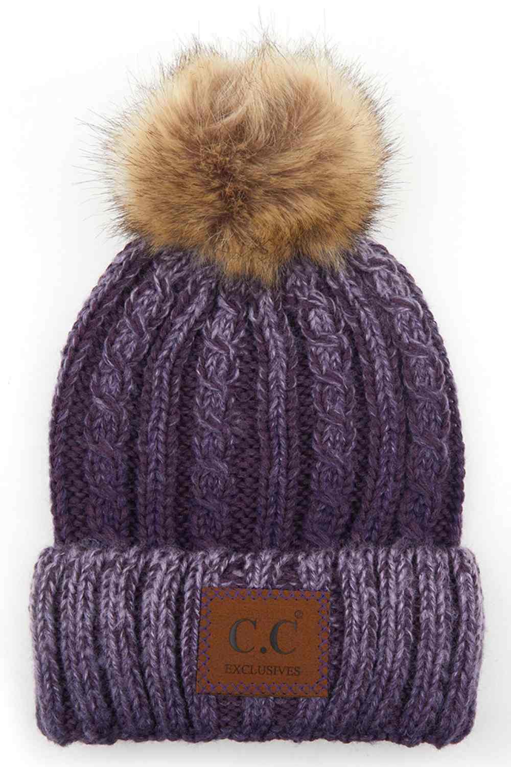 Purple Elevate your winter wardrobe with this C.C ombre beanie featuring a plush faux fur pom. Crafted from 100% acrylic, the soft knit construction provides warmth and comfort without bulk. Perfect for casual outings or layering under winter gear.