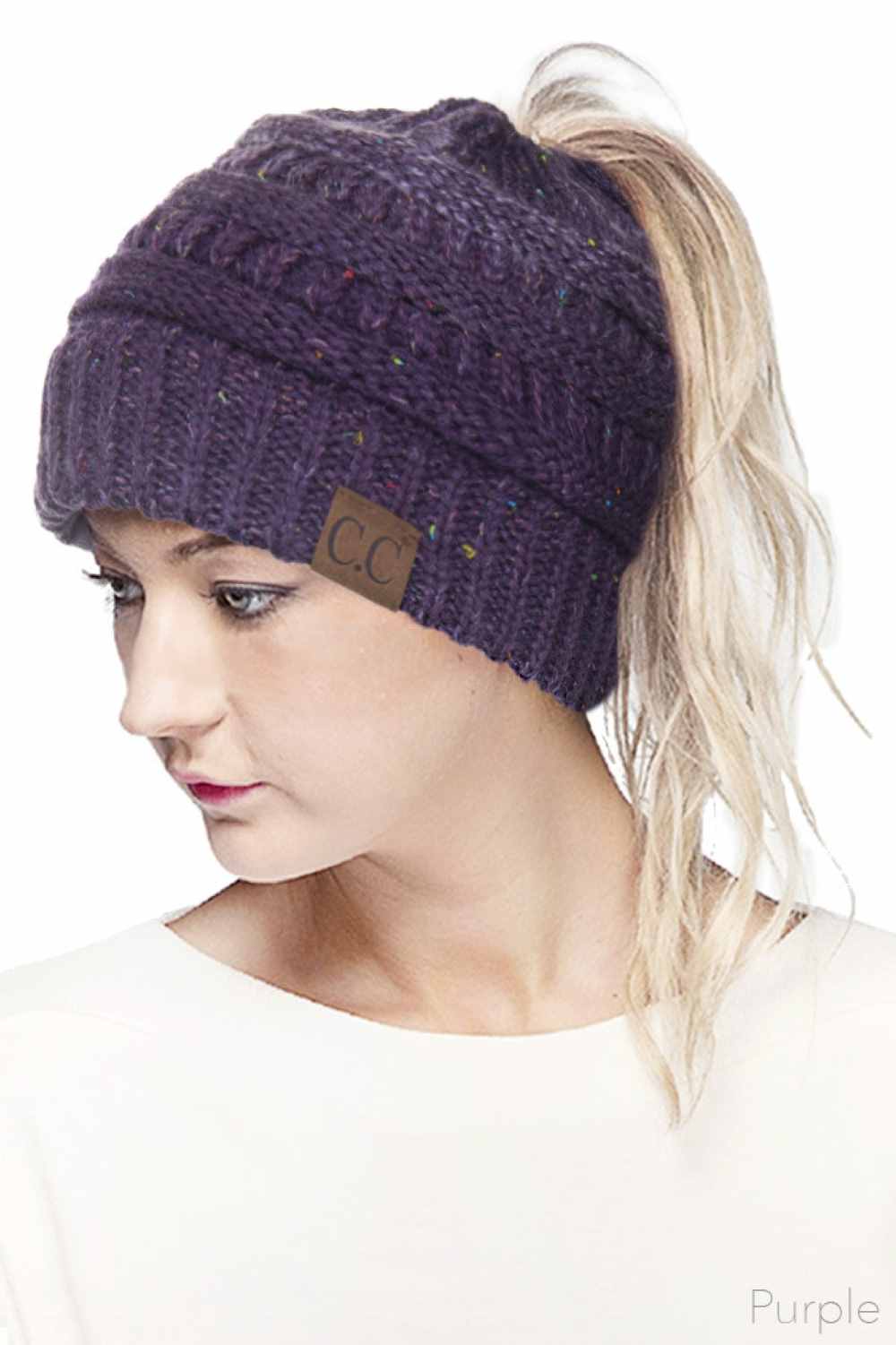 Purple Stay cozy and stylish with the C.C Ombre Confetti Messy Bun Ponytail Beanie. Crafted from 100% acrylic, this versatile beanie features a trendy messy bun opening that lets you wear your hair down while staying warm. The soft, stretchy fabric provides all-day comfort and durability, making it perfect for casual outings or outdoor adventures.&nbsp;