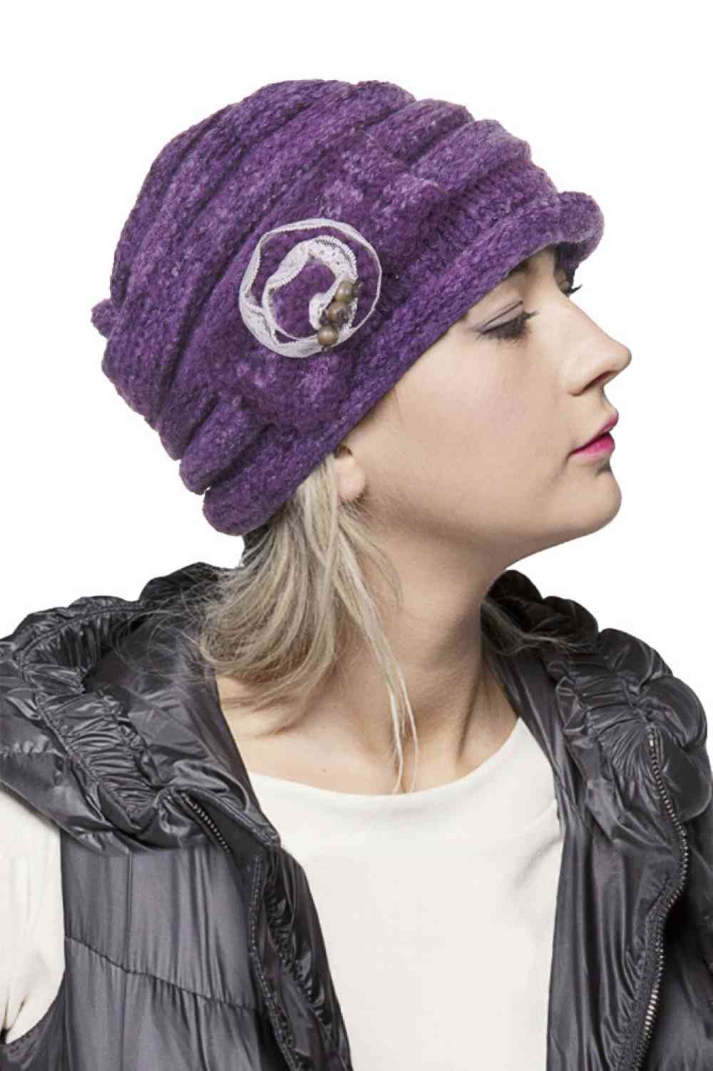 Purple Elevate your winter wardrobe with this C.C Lace Bow Trim Knitted Beanie, crafted from 100% soft acrylic for ultimate comfort and warmth. The delicate lace bow trim adds a feminine touch to this classic cold-weather essential, while the quality knit construction ensures durability through countless seasons. Perfect for layering with your favorite outfits, this beanie delivers both style and functionality. Available in versatile shades to complement any look.
