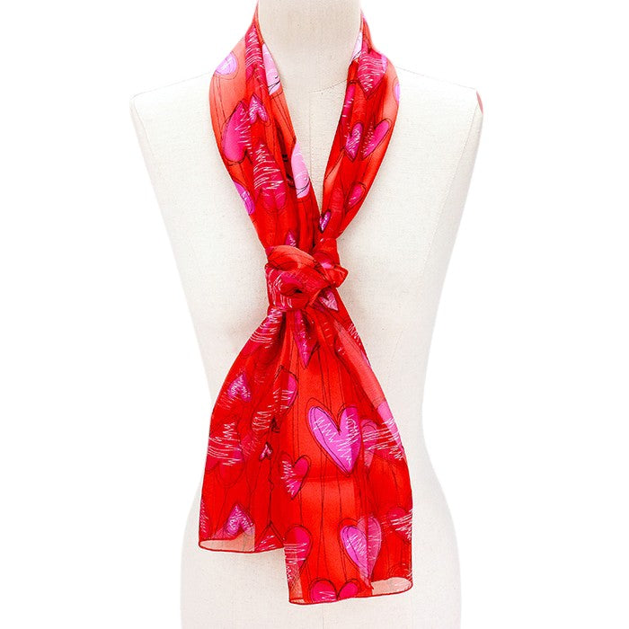 Red Silk Feel Striped Heart Pattern Scarves are designed with a soft and luxurious silk-like material that guarantees comfortable and lightweight wear. The elegant striped heart pattern adds a touch of sophistication to any outfit. Perfect as a gift or a stylish addition to your wardrobe.