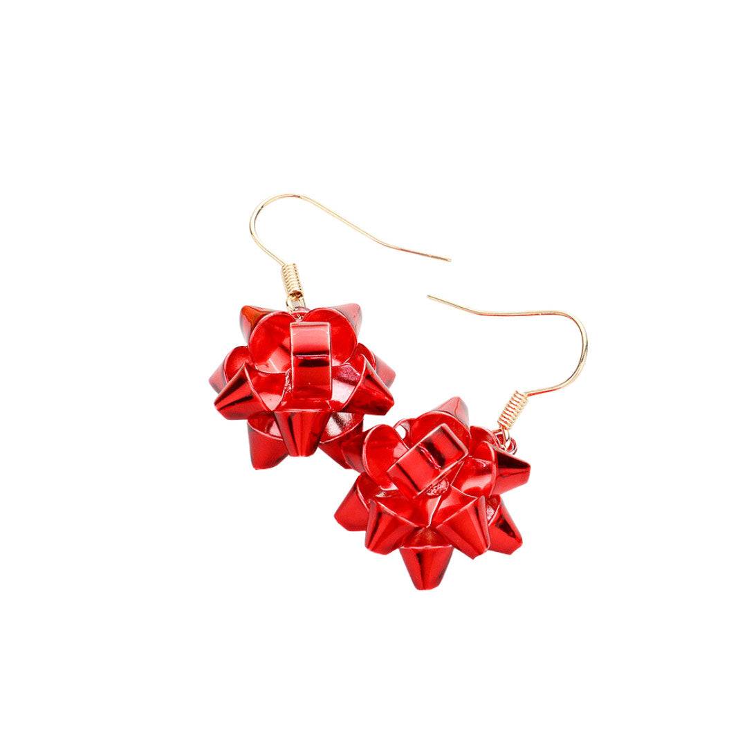 Red Beautiful Christmas Gift Bow Dangle Earrings, are beautifully designed with a bow theme that will make a glowing touch on everyone. These beautiful earrings are the ultimate representation of your class & beauty. These are the perfect gift for Christmas, especially for your friends, family, and the persons you love.