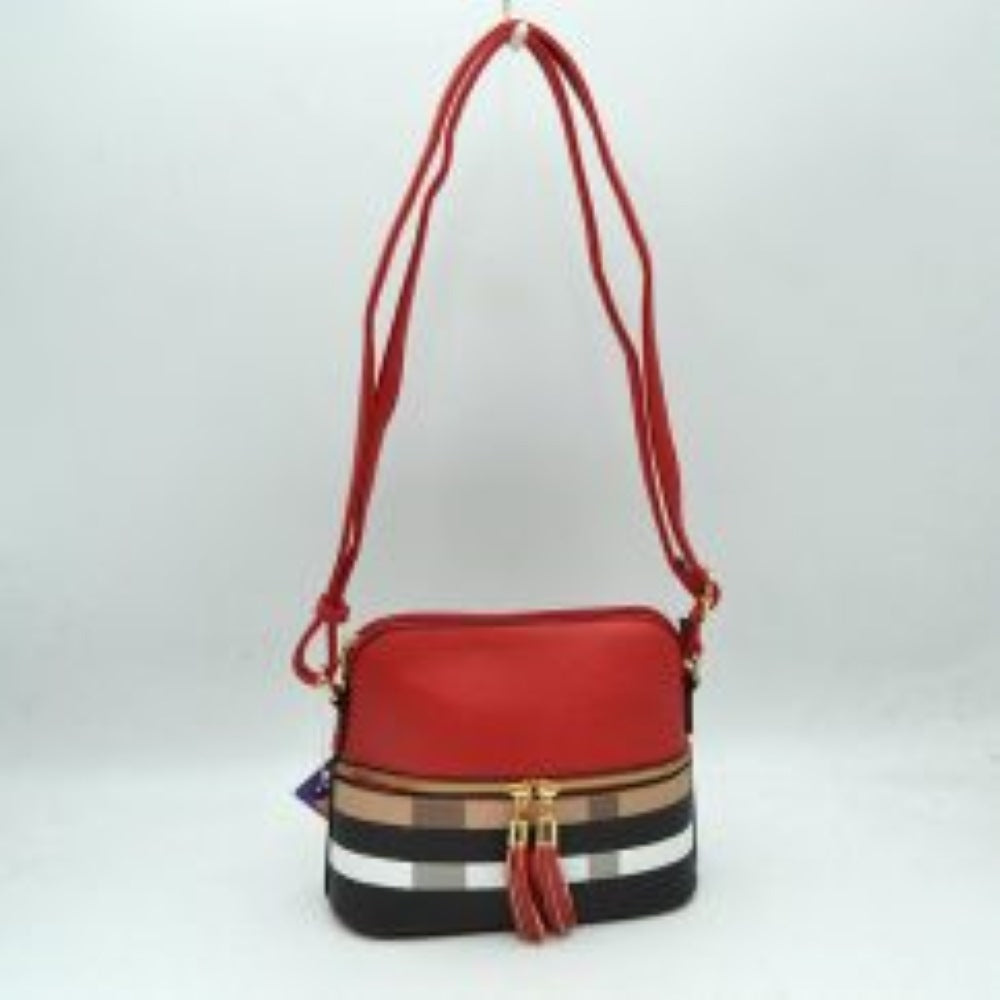 Red-Brown This compact crossbody bag features a structured dome silhouette with a smooth upper half and a bold plaid pattern across the lower section, making it an excellent choice for everyday use. It offers multiple storage compartments, including a secure top-zippered main opening and a secondary front-zippered pocket embellished with dual gold-tone pulls and hanging tassels. A long, slender adjustable shoulder strap connects via metallic side rings