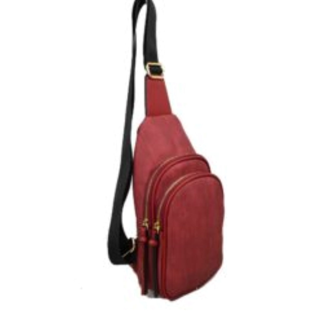 Red This practical sling bag features a textured, finely ribbed exterior w/ a tapered silhouette designed for comfortable everyday use. It offers organized storage compartments, including a curved main zippered section and a matching smaller front zippered pouch, both enhanced by elongated vertical tassel pulls hanging from the sliders. The bag is equipped w/ a single wide fabric shoulder strap attached to a smooth top panel & secured w/ a metallic adjustment buckle to easily customize the carrying length.