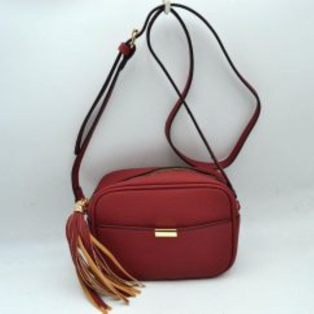 Red This sophisticated crossbody bag features a structured camera-bag silhouette crafted from a textured pebbled faux leather in a neutral beige tone, making it a versatile addition to any wardrobe. The clean-lined front is detailed with a subtle open slip pocket highlighted by a polished, gold-tone metal hardware accent at the center. Secured by a smooth top-zipper closure, the bag is finished with an adjustable shoulder strap and a dramatic