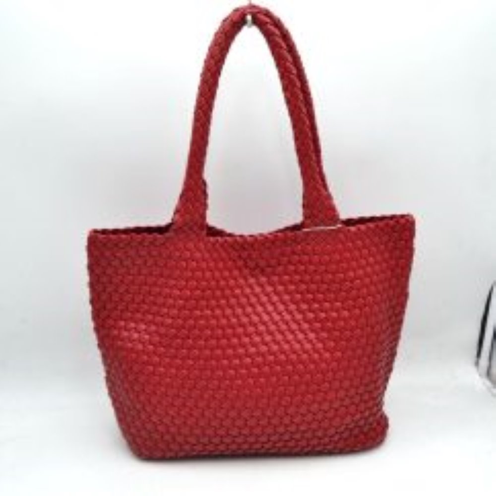 Red This structured tote bag features an intricate basket-weave design across its body and integrated shoulder straps, creating a textured look suitable for everyday use. The main storage compartment offers a wide, open-top design for easy access to daily essentials. Accompanying the larger bag is a matching smaller pouch with a distinct woven exterior pattern and a secure gold-tone top zipper closure to keep smaller items organized.