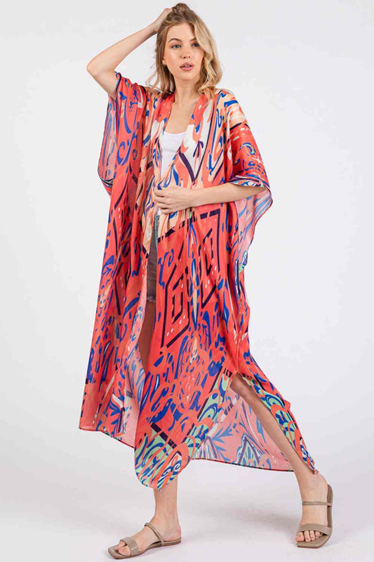 Red Effortless bohemian elegance meets summer comfort in this open-front kimono cover-up. Crafted from lightweight 100% polyester, it drapes beautifully over swimwear or casual outfits with its relaxed, flowing silhouette. The boho-inspired print adds artistic flair to any beach day or resort look. Generously sized at 35" x 47.5", it offers easy layering and movement. Perfect for poolside, beach getaways, or breezy warm-weather styling.