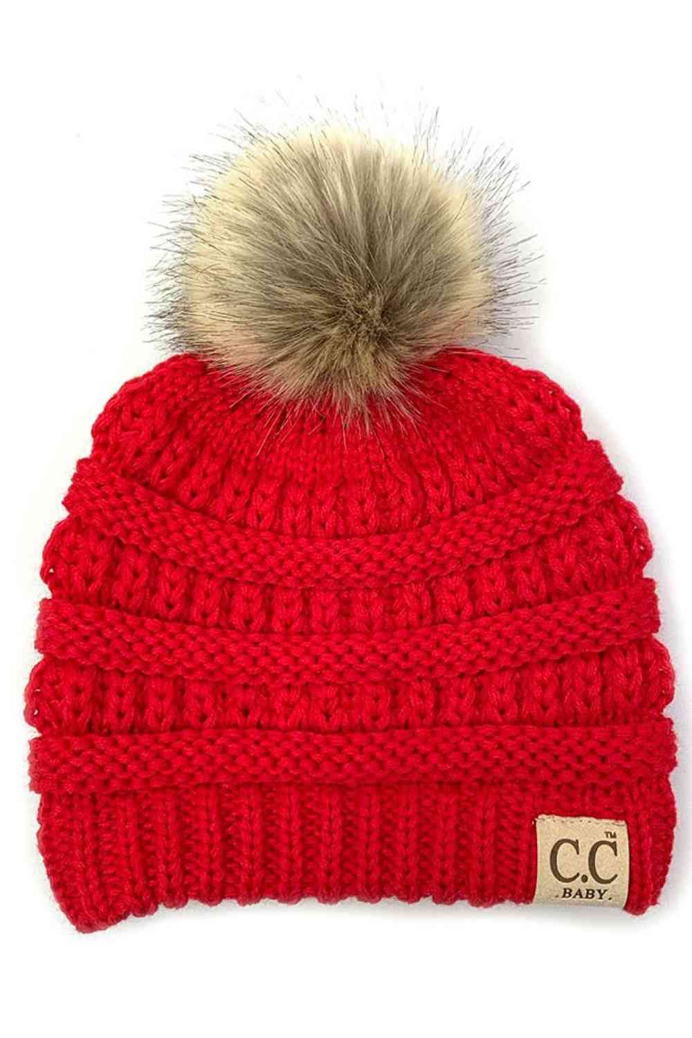 Red Keep your little one warm and cozy with this C.C Solid Ribbed Infant Beanie. Made from 100% acrylic, the soft ribbed knit construction provides gentle comfort against delicate skin while the natural fur pom adds a charming detail.