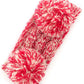 Red Cozy two-tone kids head wrap featuring a soft fuzzy lining for extra warmth and comfort. Double pom-pom design adds playful style perfect for cold weather. Crafted from 100% acrylic for durability and easy care. One size fits most children. A practical accessory that keeps little ones warm while looking adorable.