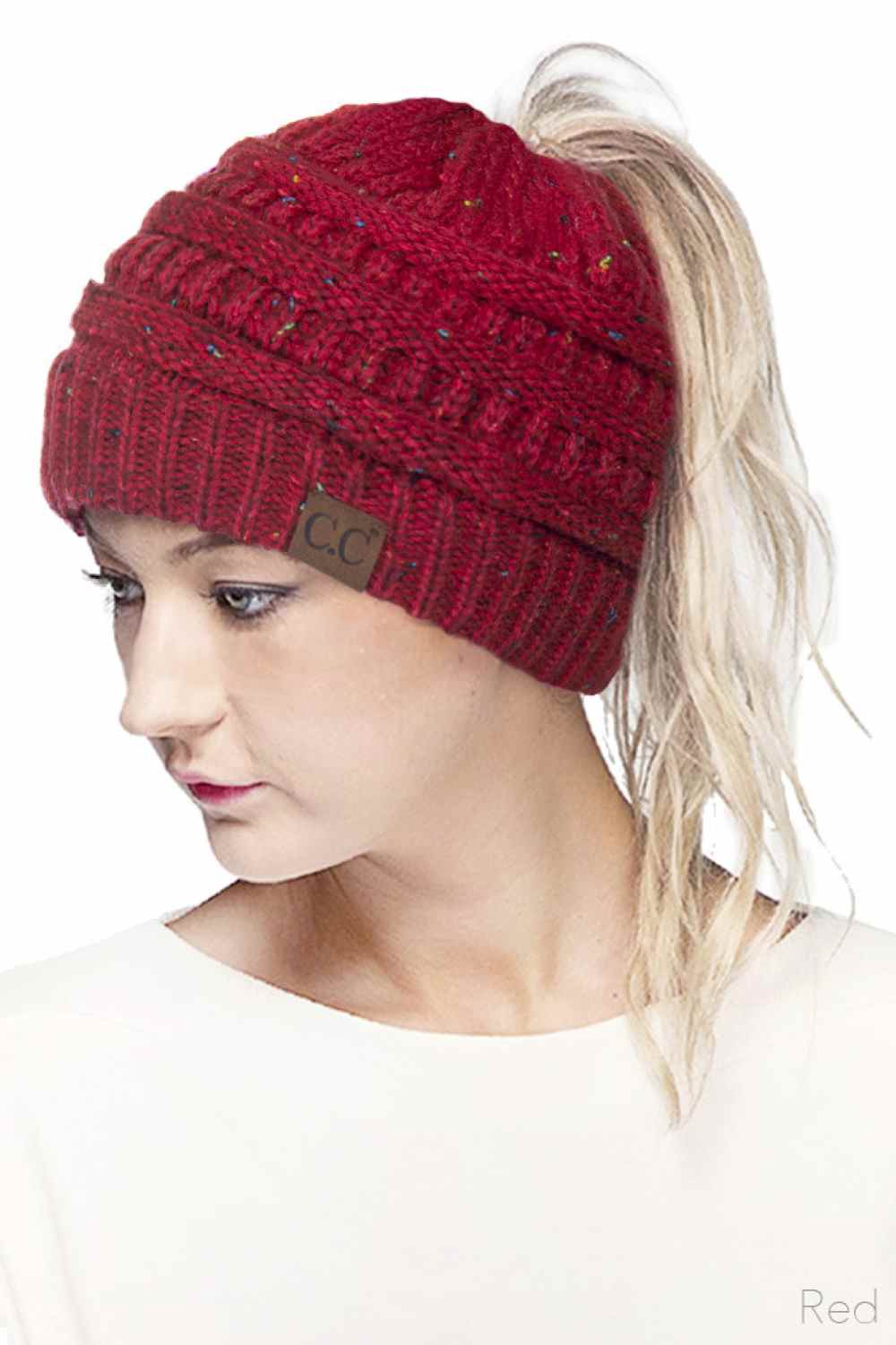 Red Stay cozy and stylish with the C.C Ombre Confetti Messy Bun Ponytail Beanie. Crafted from 100% acrylic, this versatile beanie features a trendy messy bun opening that lets you wear your hair down while staying warm. The soft, stretchy fabric provides all-day comfort and durability, making it perfect for casual outings or outdoor adventures.&nbsp;