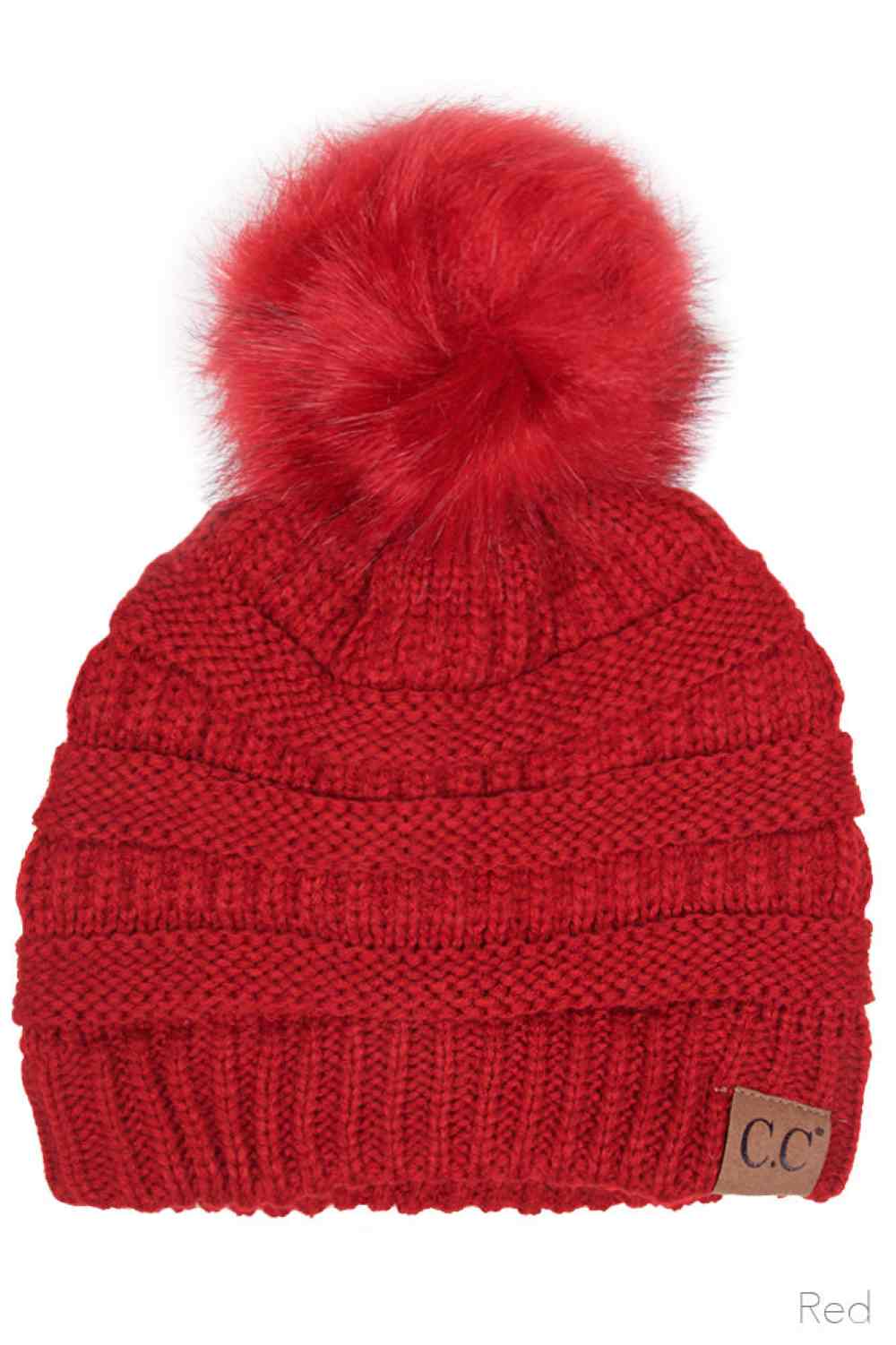 Red Elevate your winter wardrobe with this classic C.C knitted beanie, crafted from 100% soft acrylic for exceptional warmth and comfort. The signature fur pom pom adds a touch of sophistication, while the one-size-fits-most design ensures a flattering fit for virtually anyone. Perfect for layering during cold months, this versatile beanie transitions seamlessly from casual outings to outdoor adventures. The premium acrylic blend resists pilling and maintains its shape season after season, making it a relia