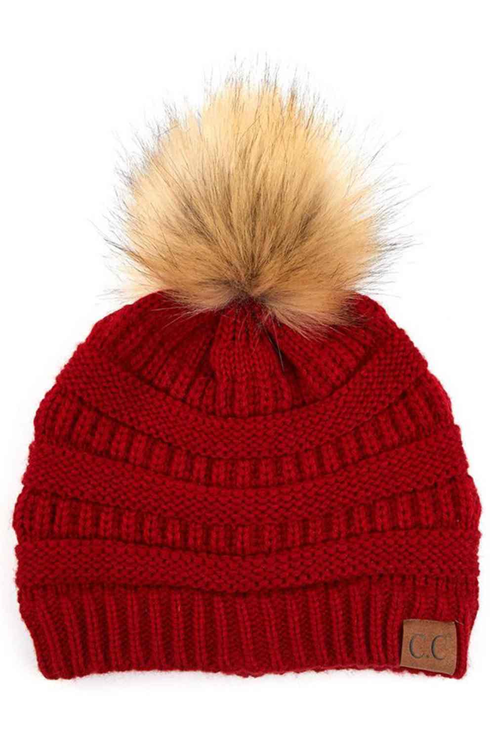 Red Stay warm and cozy with this classic C.C Pom Pom Knit Beanie, crafted from 100% soft acrylic for all-day comfort. The ribbed knit design adds texture and durability, while the signature pom pom on top brings a playful touch to any winter outfit. One size fits most, making it the perfect accessory for everyone. Ideal for cold weather adventures or casual everyday wear.