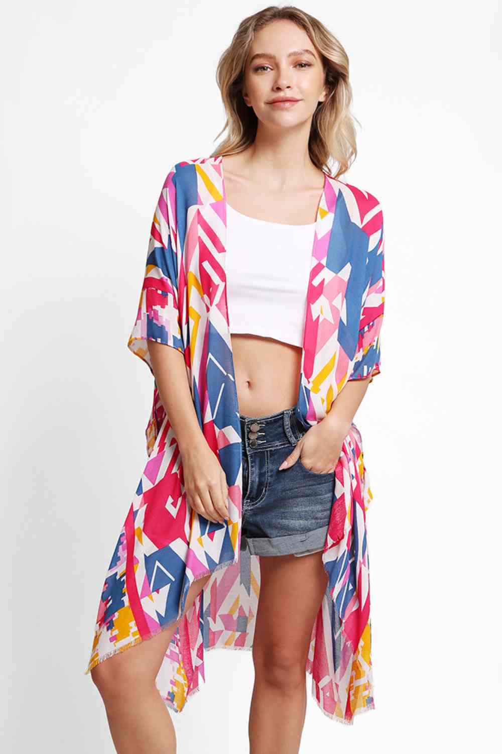 Red Elevate your beach wardrobe with this stunning geometric abstract kimono cover up. Made from breathable 100% viscose, it's the perfect lightweight layer for sun-soaked days. The eye catching abstract pattern brings contemporary flair to any swimwear ensemble. With generous dimensions of 38" x 39", this cover up offers comfortable coverage and an easy, relaxed silhouette. Ideal for transitioning from beach to brunch in effortless style.