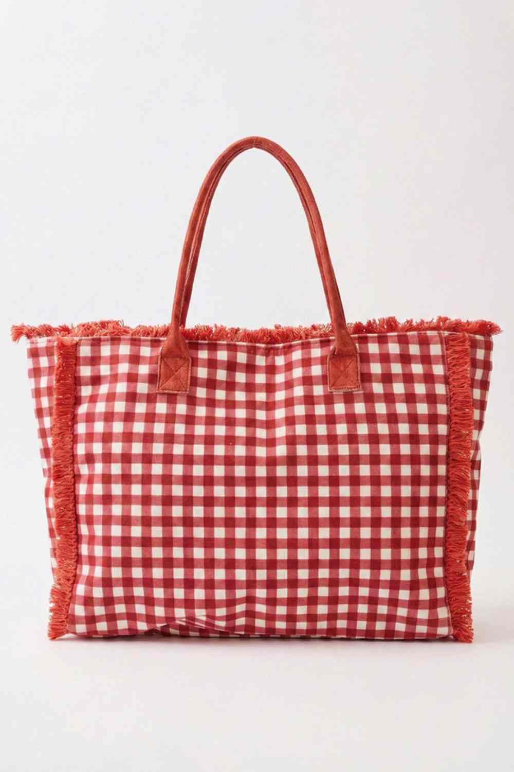 Red Carry your essentials in style with this charming gingham check tote. Featuring a classic black and white pattern with playful frayed trim detailing, it's the perfect everyday companion. Crafted from durable 100% polyester, this spacious bag measures 17.5" x 14" x 5" and includes a secure zipper closure and convenient inner pocket for organized storage. Whether you're heading to the market, office, or weekend getaway, this versatile tote blends functionality with timeless design.