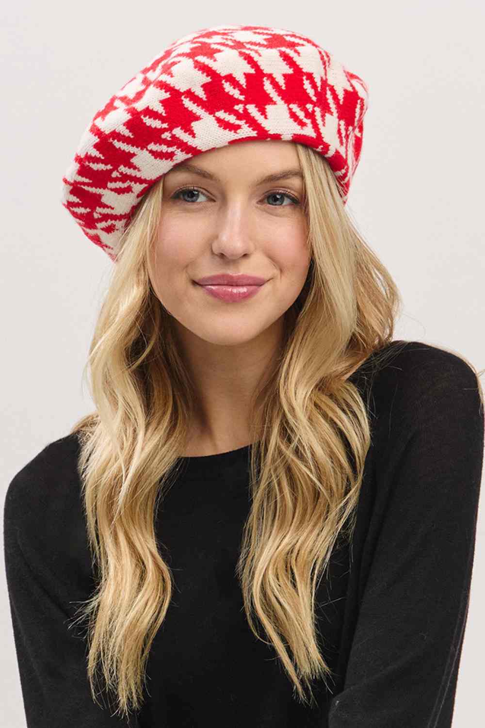 Red Elevate your winter style with this sophisticated houndstooth pattern beret featuring a striking two-tone knit design. Crafted from 100% acrylic for durability and comfort, this one-size beret delivers timeless elegance whether you're dressing up or keeping it casual. The classic houndstooth pattern adds visual interest to any outfit, making it the perfect accessory for cooler months.