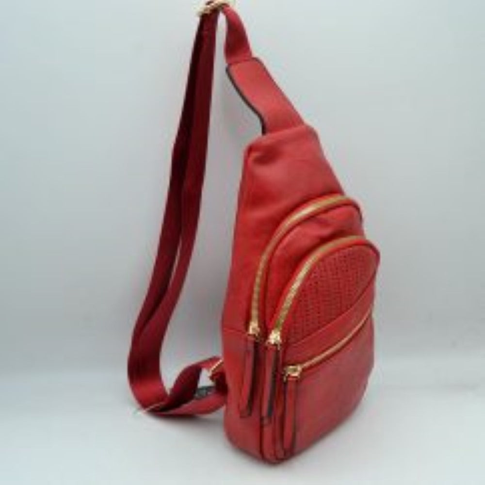 Red This versatile sling bag features an asymmetric silhouette decorated with an arched, perforated pattern on the front panel, making it suitable for everyday use. It offers multiple organized storage compartments, including a main curved section, a mid-sized front zippered pouch, and a smaller diagonal zippered pocket near the base, all equipped with elongated pull tabs. Designed for convenience, the bag is completed with a single wide