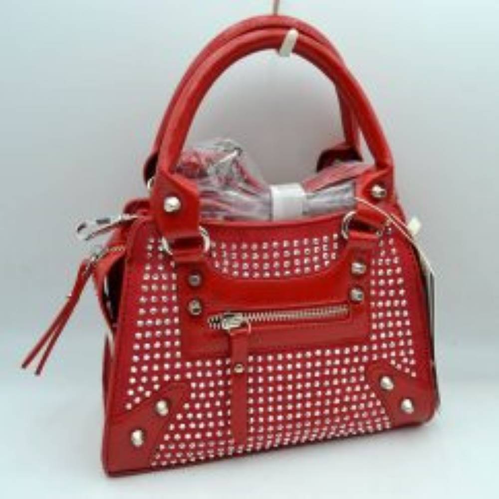 Red This striking satchel bag features an elaborate array of rounded studs arrayed across the front panel, complemented by metallic corner patches and decorative rivets. Perfect for bringing a touch of bold style to everyday wear, it is designed with dual structured top handles for comfortable handheld carrying and features a front zippered storage compartment with a matching pull tab for easy access to smaller items. A secure main zippered closure ensures your daily essentials are protected
