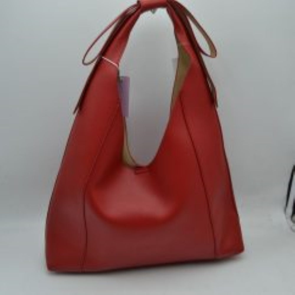 Red This everyday shoulder bag features a distinctive slouchy silhouette with a wide, integrated strap that is elegantly tied at the top. The spacious open-top main compartment offers effortless access to your daily essentials, while the clean design showcases a subtly textured exterior surface. Designed for comfortable over-the-shoulder wear, this versatile piece combines a modern aesthetic with practical, everyday functionality.