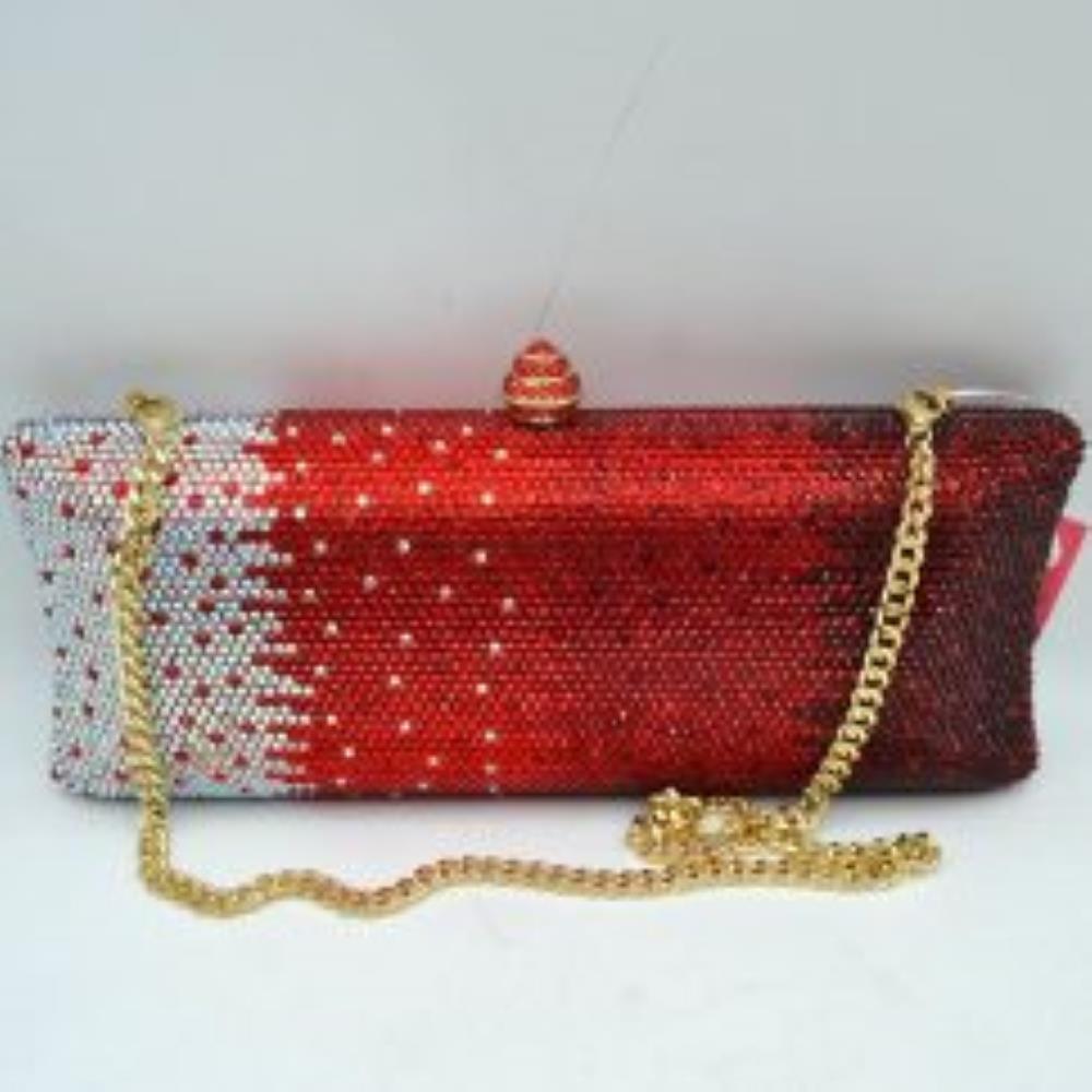 Red-silver This structured clutch bag features an elongated silhouette with subtly flared edges, completely covered in fine, glittering micro-embellishments that create a shimmering, textured surface suitable for elegant everyday use. The central storage compartment is securely accessed via a hard-frame opening with an ornamental, rounded top clasp. A long, slender metallic curb chain strap is permanently attached to the top loops