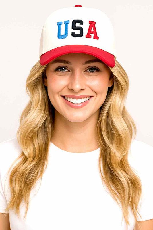 Red USA Multi Color Embroidered Letter on Two Tone Baseball Cap Elevate your casual style with this striking baseball cap showcasing a USA embroidered letter in eye-catching multi-color thread. The two-tone construction blends contrasting hues for a modern, dynamic look that works with any wardrobe. Crafted entirely from 100% cotton, this cap offers exceptional breathability and softness for comfortable wear throughout the day. The universal one-size fit ensures it works for most head sizes. Whether you're 