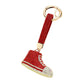 Red Rhinestone Pave Sneaker Bag Charm features a sparkling rhinestone pave design that is sure to add a touch of glamour to any bag. The charm is perfect for sneaker lovers and fashionistas alike, making it a versatile and stylish accessory. With its high-quality construction, this charm is a must-have for any fashion-forward individual.