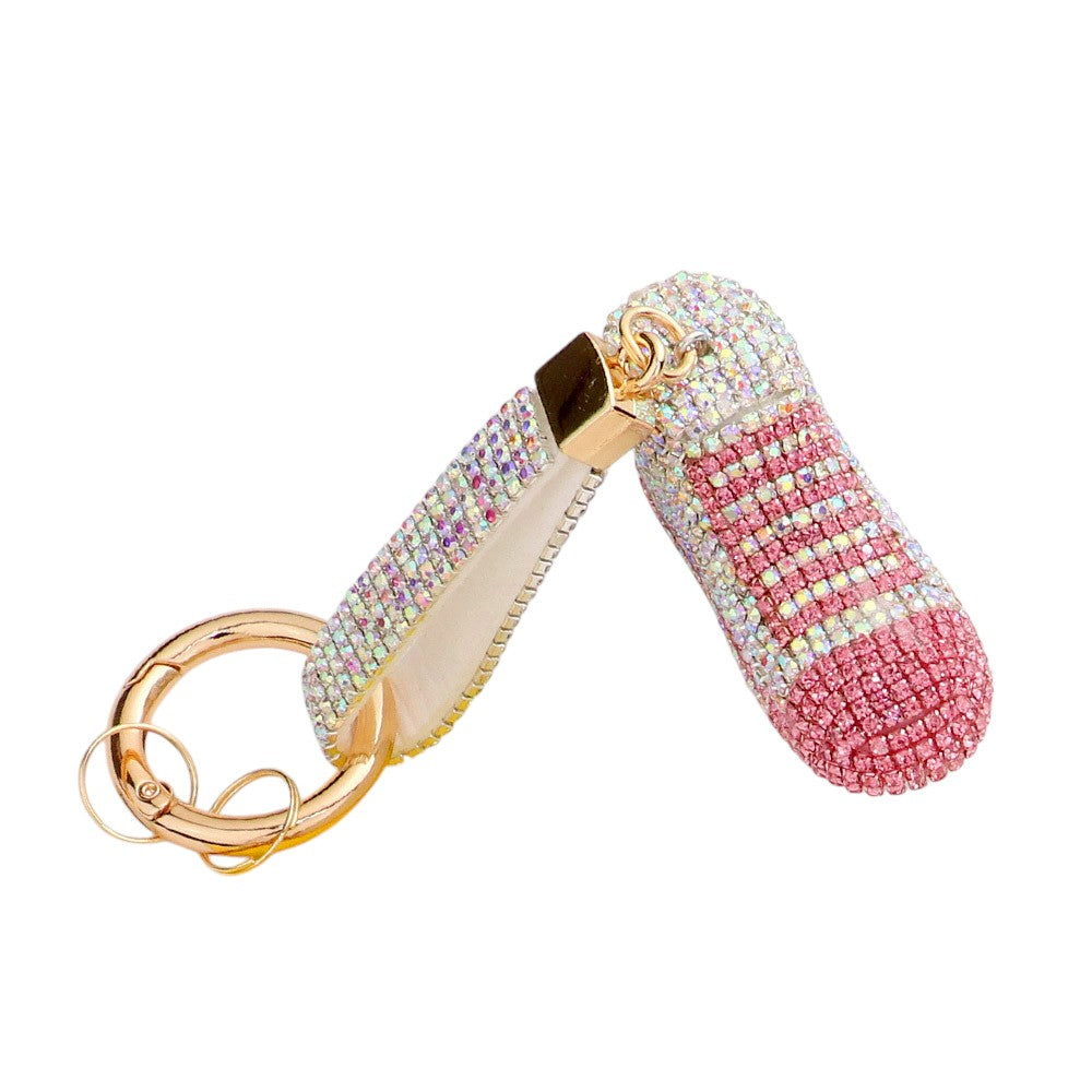 AB Rhinestone Pave Sneaker Bag Charm features a sparkling rhinestone pave design that is sure to add a touch of glamour to any bag. The charm is perfect for sneaker lovers and fashionistas alike, making it a versatile and stylish accessory. With its high-quality construction, this charm is a must-have for any fashion-forward individual.