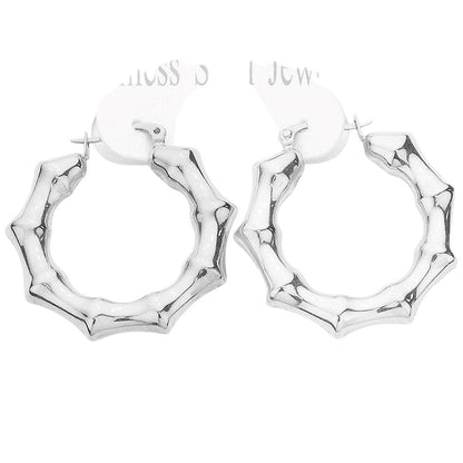 Rhodium 18K Gold Dipped Stainless Steel 1.5 Inch Metal Bamboo Hoop Earrings are expertly crafted using high-quality materials to provide a luxurious and durable accessory. The gold dipping process ensures a glossy finish and the 1.5-inch diameter adds a touch of elegance to any outfit.
