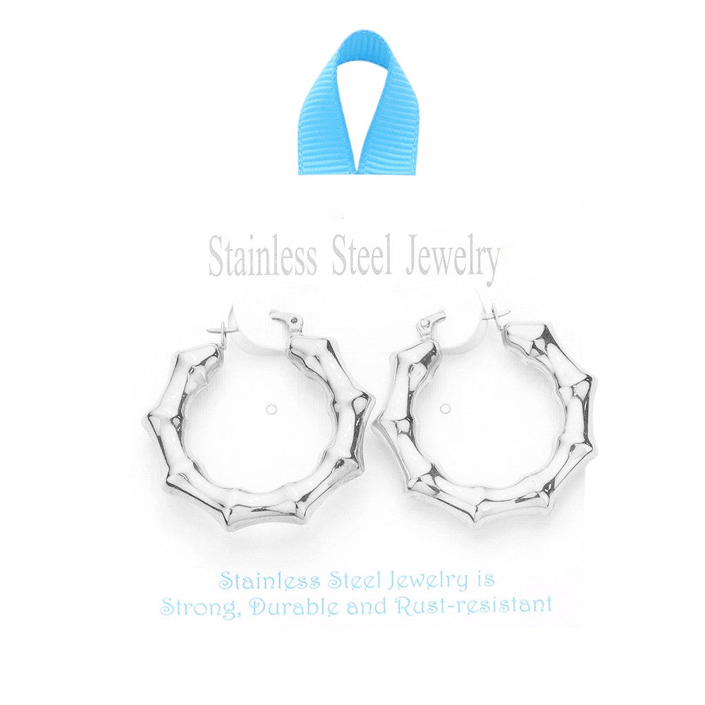 Rhodium 18K Gold Dipped Stainless Steel 1.5 Inch Metal Bamboo Hoop Earrings are expertly crafted using high-quality materials to provide a luxurious and durable accessory. The gold dipping process ensures a glossy finish and the 1.5-inch diameter adds a touch of elegance to any outfit.