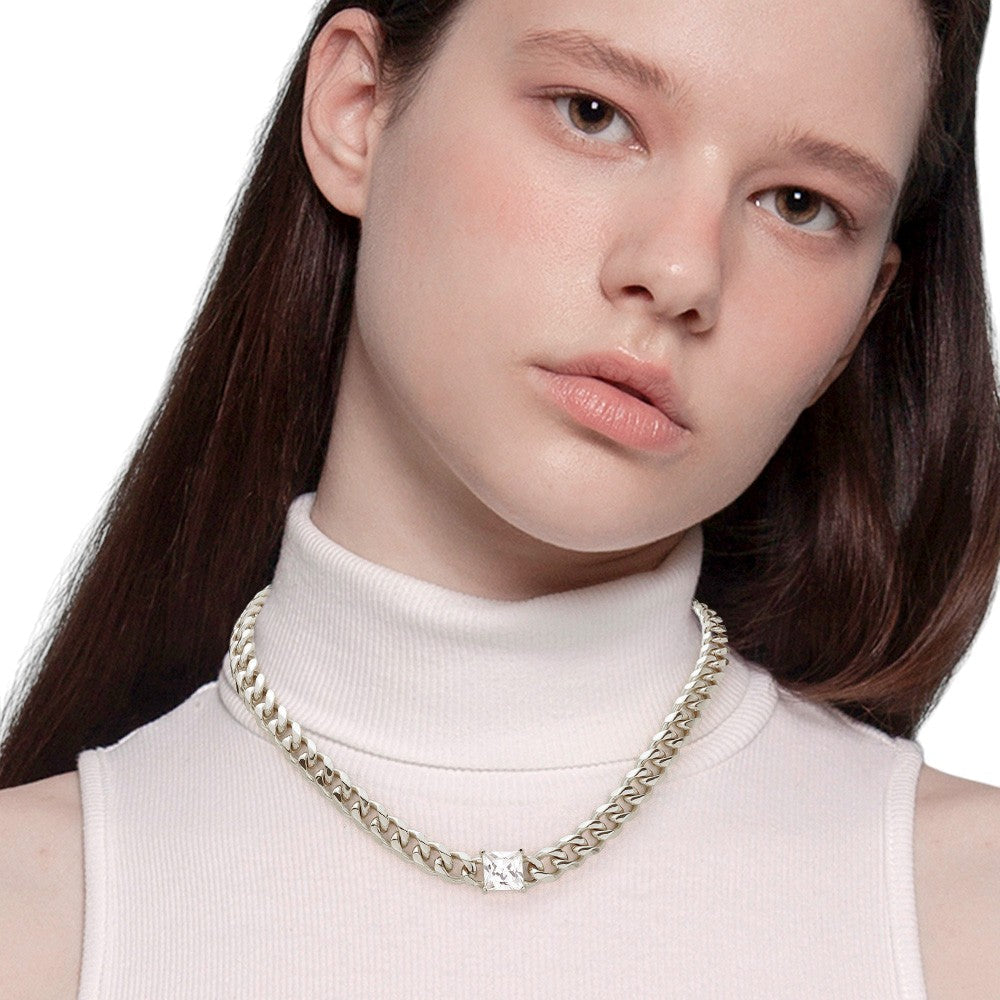 Rhodium 18K Gold Dipped Stainless Steel CZ Square Stone Accented Necklace features high-quality stainless steel dipped in 18K gold, adorned with a beautifully sparkling CZ square stone. Crafted with precision and durability, this elegant necklace is perfect for any occasion. Enjoy the luxurious shine of gold and the lasting strength of stainless steel, making it a timeless addition to your collection. 