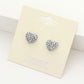 Rhodium Crystal Pave Heart Stud Earrings add elegance to any outfit. The sparkling pave design is crafted precisely, and the heart shape symbolizes love and affection, making them the perfect accessory for any special occasion.